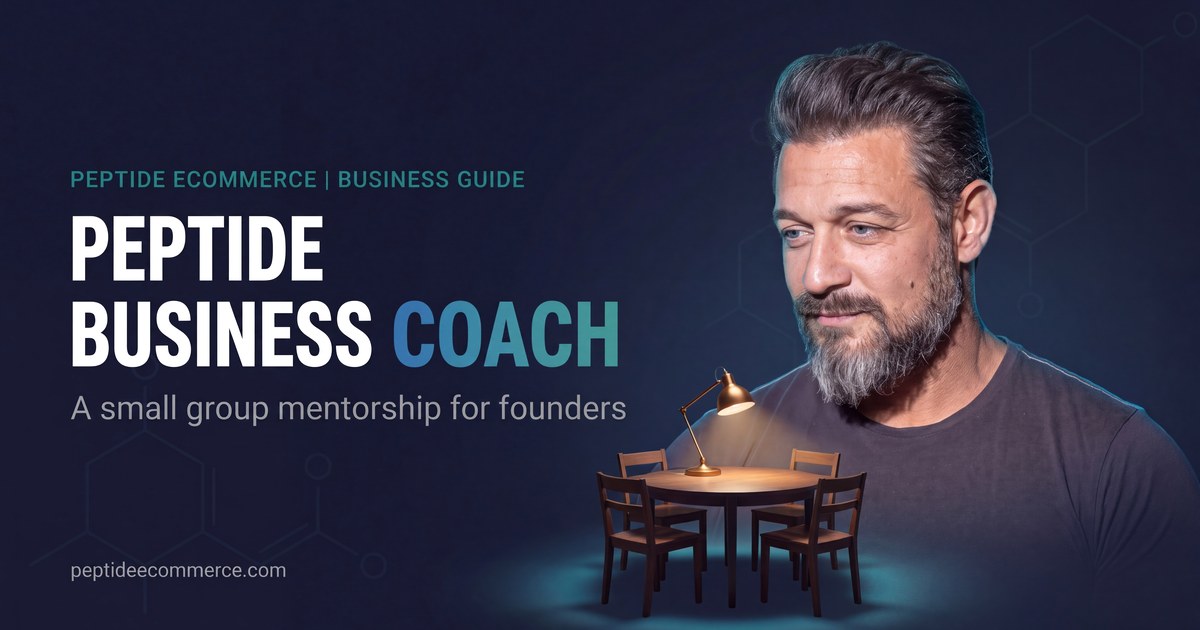 Sean Rakidzich, peptide business coach, beside a lamp lit table for small group mentorship